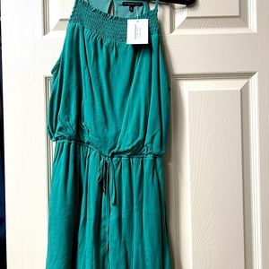 Emerald green romper, relaxed fit. New with tags, size small.